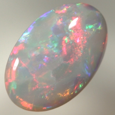 SOLID SEMI BLACK OPAL Bright crisp rolling flashes. Fire red, neon yellow, green and blue